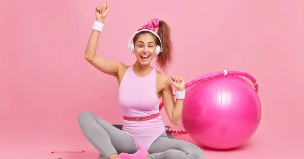 woman with pink gym ball
