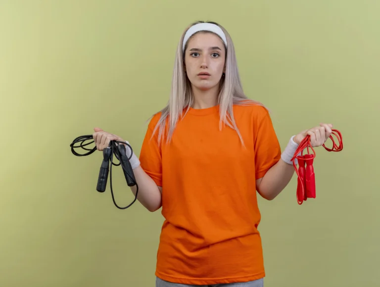 woman holding skipping ropes