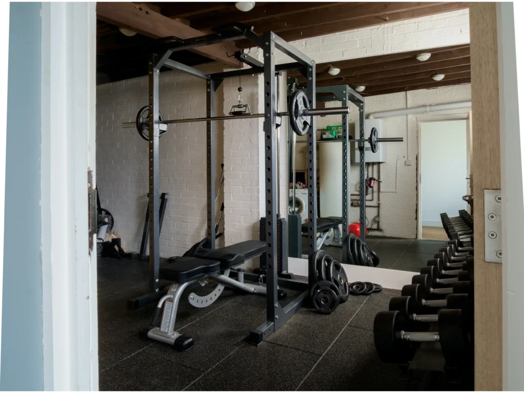 A full squat rack with a bench.